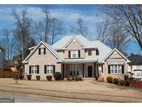 Charming brick home with a well-manicured lawn and beautiful landscaping at 2920 Stanway Ave, Douglasville, GA 30135