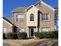 Charming two-story brick home with a well-maintained front yard, perfect for families at 10467 Tara Beach Cir, Jonesboro, GA 30238