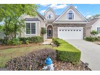 Charming home with stone accents, manicured landscaping, and a two-car garage, perfect for suburban living at 168 Maple Grove Ter, Peachtree City, GA 30269