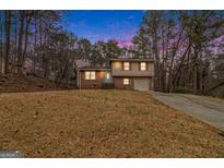 Charming two-story brick home with a well-manicured front yard and an inviting driveway at 620 Bell Se Rd, Conyers, GA 30094