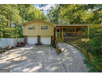 Split level home with two car garage and covered front porch at 6226 Lullwater Dr, Douglasville, GA 30135