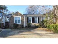 Charming single-story home with stone accents and well-maintained landscaping at 358 Pin Oak Sw Ct, Marietta, GA 30008