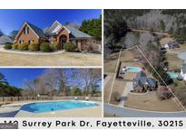 Charming brick home featuring manicured landscaping, a symmetrical design, and a welcoming entrance at 140 Surrey Park Dr, Fayetteville, GA 30215