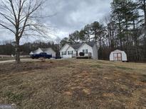 Charming single-Gathering home with a well-maintained front yard and white siding at 220 Joe Dr, Temple, GA 30179