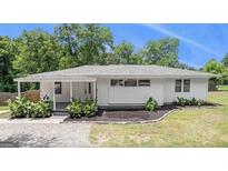 Charming single-story home with a well-maintained lawn and covered porch at 3132 Emory Sw St, Covington, GA 30014