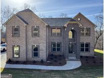 This is a charming two-story brick home with a well-manicured lawn and elegant architectural detailing at 5915 Langdale Chase # 16, Douglasville, GA 30135