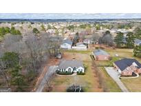 Spacious homes in a quiet neighborhood with mature trees and well-maintained yards at 3403 Bill Gardner Pkwy, Locust Grove, GA 30248