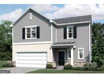 Charming two-story home with gray siding, black shutters, and a two-car garage at 7728 Sudbury Cir, Covington, GA 30014