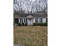 Charming single-story home with light gray siding, black shutters, and a welcoming light blue front door at 2753 S Highway 92 S, Fayetteville, GA 30215