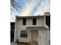 Charming two-story townhome with a white brick facade and inviting front entrance at 746 Dunaire Way, Jonesboro, GA 30238