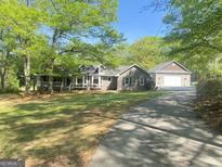 Charming home with a well-manicured lawn and attached garage, perfect for suburban living at 848 Still Rd, Lawrenceville, GA 30045