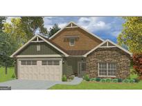 Charming craftsman-style home with stone accents, inviting curb appeal, and a two-car garage at 11144 Cornerstone Way, Hampton, GA 30228