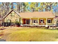 Charming ranch-style home with inviting front porch and well-manicured lawn at 230 White Rd, Fayetteville, GA 30214