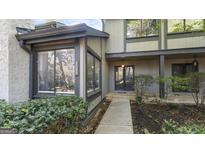 Charming home featuring a well-maintained walkway leading to a welcoming front door at 3099 Balearic Se Dr, Marietta, GA 30067