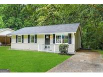 Charming single-story home with a well-maintained lawn and traditional curb appeal at 1145 Penn Se Ct, Atlanta, GA 30315