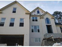 A beautiful, two-story, newly constructed house with large windows and brick exterior at 2910 Battlecrest Dr, Decatur, GA 30034