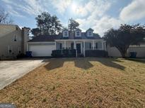 Charming one-story home featuring dormer windows, covered entry porch, and a two-car garage at 2260 Burdett Ridge Dr, South Fulton, GA 30349