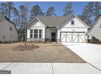 Charming single-Gathering home with a two-car garage and inviting curb appeal in a serene neighborhood at 82 Airmont Dr, Sharpsburg, GA 30277