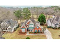 Stunning brick home featuring manicured landscaping and a welcoming two-story entryway at 2510 Shoreline Pkwy, Villa Rica, GA 30180