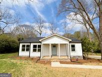 Charming renovated single-story home with a welcoming front porch and a well-manicured lawn at 299 Lagrange St, Grantville, GA 30220