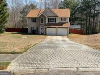 Charming two-story home featuring a two-car garage and a traditional design at 7228 Silverleaf Cir, Fairburn, GA 30213
