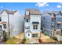 Charming two-story home with blue siding, brick accents, and well-maintained landscaping at 1045 Kirkland Cir, Smyrna, GA 30080