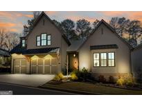 Charming two-story home with neutral siding, manicured landscaping, and a two-car garage in a quiet neighborhood at 1110 Blair Ln, Peachtree City, GA 30269