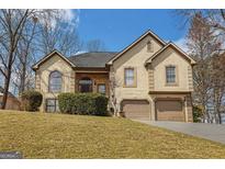 Charming two-story home with a well-manicured lawn and a two-car garage at 3435 Pierce Arrow Cir, Suwanee, GA 30024