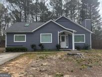 Charming single-story home with gray siding, a well-manicured front yard, and a welcoming entrance at 102 Beaver Dam Rd, Peachtree City, GA 30269