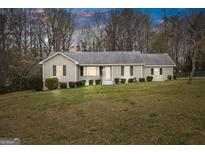 Charming single-story home with a well-maintained lawn and cozy curb appeal at 1312 Milstead Ne Ave, Conyers, GA 30012