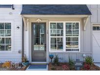 Inviting front door with sidelight windows, a Ring security system, and a well-maintained entryway at 16 Becker Nw Pl, Atlanta, GA 30307