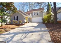 Charming two-story home features a two-car garage and inviting curb appeal at 626 N Fairfield Dr, Peachtree City, GA 30269