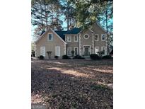 Stately two-story home featuring a well-maintained lawn and traditional architectural details at 121 Tamerlane, Peachtree City, GA 30269