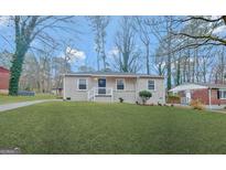 Charming single-story home with manicured lawn and inviting front porch at 263 Banberry Se Dr, Atlanta, GA 30315