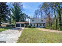 Charming two-story home featuring a spacious front yard and a three-car garage at 2282 Tiffany Ct, Jonesboro, GA 30236