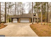 Charming home with a three-car garage, and a long driveway at 171 Rockspray Rdg, Peachtree City, GA 30269