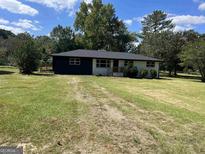 Charming single-story home with a well-maintained front yard and inviting curb appeal at 415 Crabapple Rd, Fayetteville, GA 30215