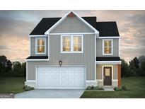 Inviting two-story home featuring a two-car garage and charming exterior lighting at 328 Wandering Brook Dr # 39, Mcdonough, GA 30253