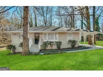 Charming single-story home with well-manicured lawn and inviting covered entrance at 4267 Lamar St, Decatur, GA 30035