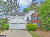 Charming two-story home with a two-car garage and well-maintained landscaping at 10018 Clearwater Trl, Jonesboro, GA 30238