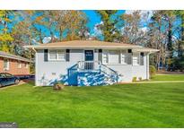 Charming one-story home with a well-maintained lawn and a classic brick exterior with black shutters at 4250 Timber Valley Ct, Decatur, GA 30032