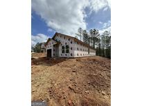 New home under construction, exterior elevation showcasing architectural design on a spacious lot at 543 Courthouse Park Dr., Temple, GA 30179