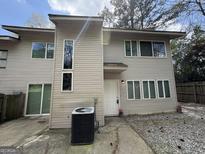 Charming home featuring a contemporary exterior with light siding, complemented by plentiful windows and a well-maintained yard at 7560 Taylor Rd # 1, Riverdale, GA 30274