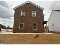 Two-story brick home featuring white trim and a well-maintained yard at 5301 Tolar Rd # 95, South Fulton, GA 30213