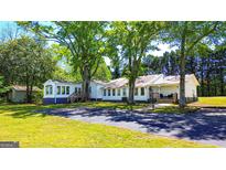 Charming single-story home with mature trees and a well-maintained lawn at 20 Rosser Rd, Mcdonough, GA 30252