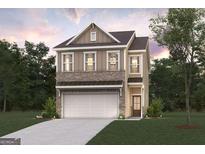 Charming two-story home with a two-car garage, brick accents, and a well-manicured lawn at 1022 Sutherland Lane # 42, Lawrenceville, GA 30043