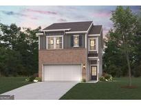 Charming two-story home with a brick and gray siding, attached garage, and a well-manicured lawn at 1030 Sutherland Lane # 46, Lawrenceville, GA 30043