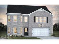 Charming two-story brick home with attached two car garage and black shutters at 223 Ferndale Dr # 114, Fairburn, GA 30213