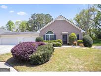 Charming brick home with well-manicured landscaping and a two-car garage at 3417 Double Eagle Dr # Bldg 31, Marietta, GA 30008