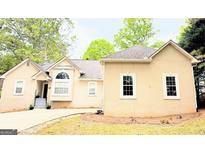 Charming single-story home with a well-manicured lawn and inviting curb appeal at 1252 Heritage Dr, Villa Rica, GA 30180